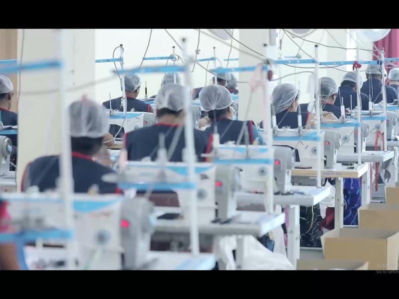 Tailors working at the stitching line